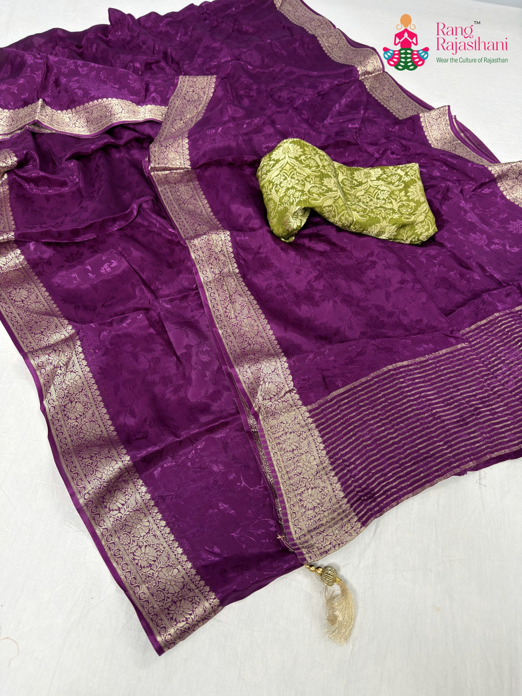 close up detailing of wine chinnon jacquard weave saree
