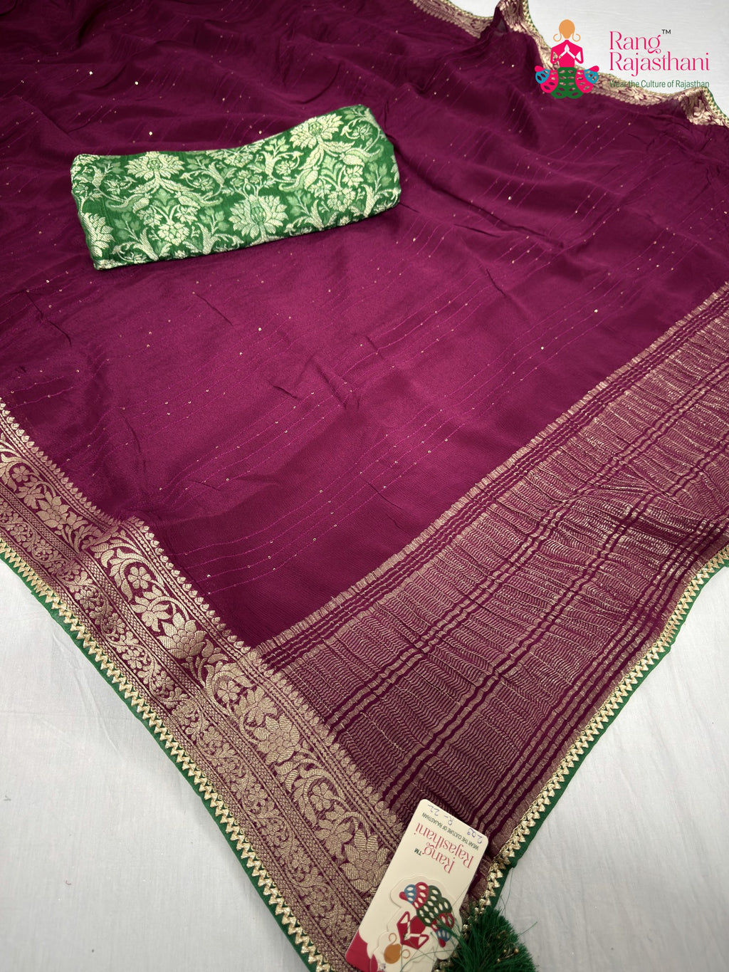 pallu detailing of wine chinnon saree