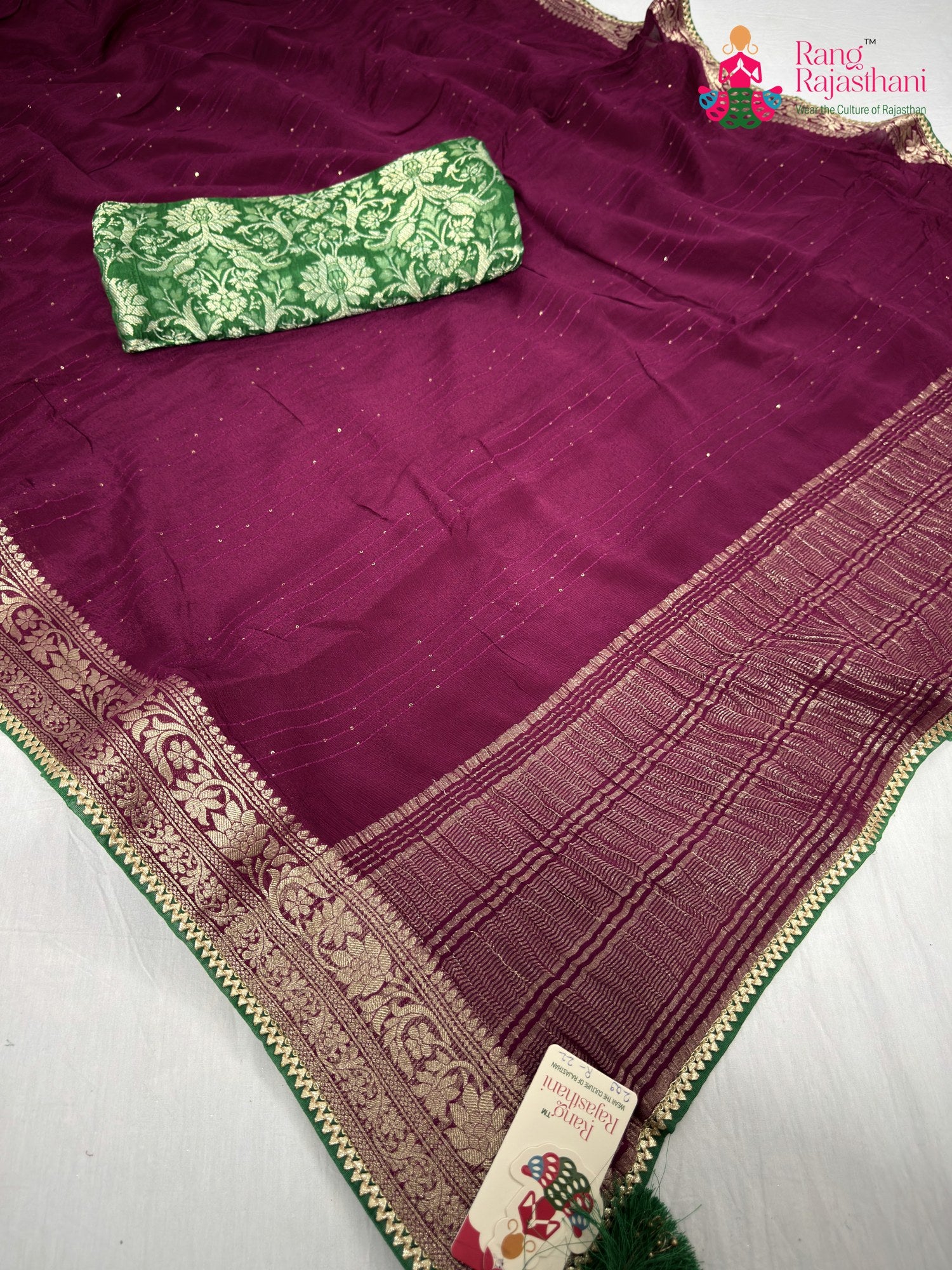 pallu detailing of wine chinnon saree
