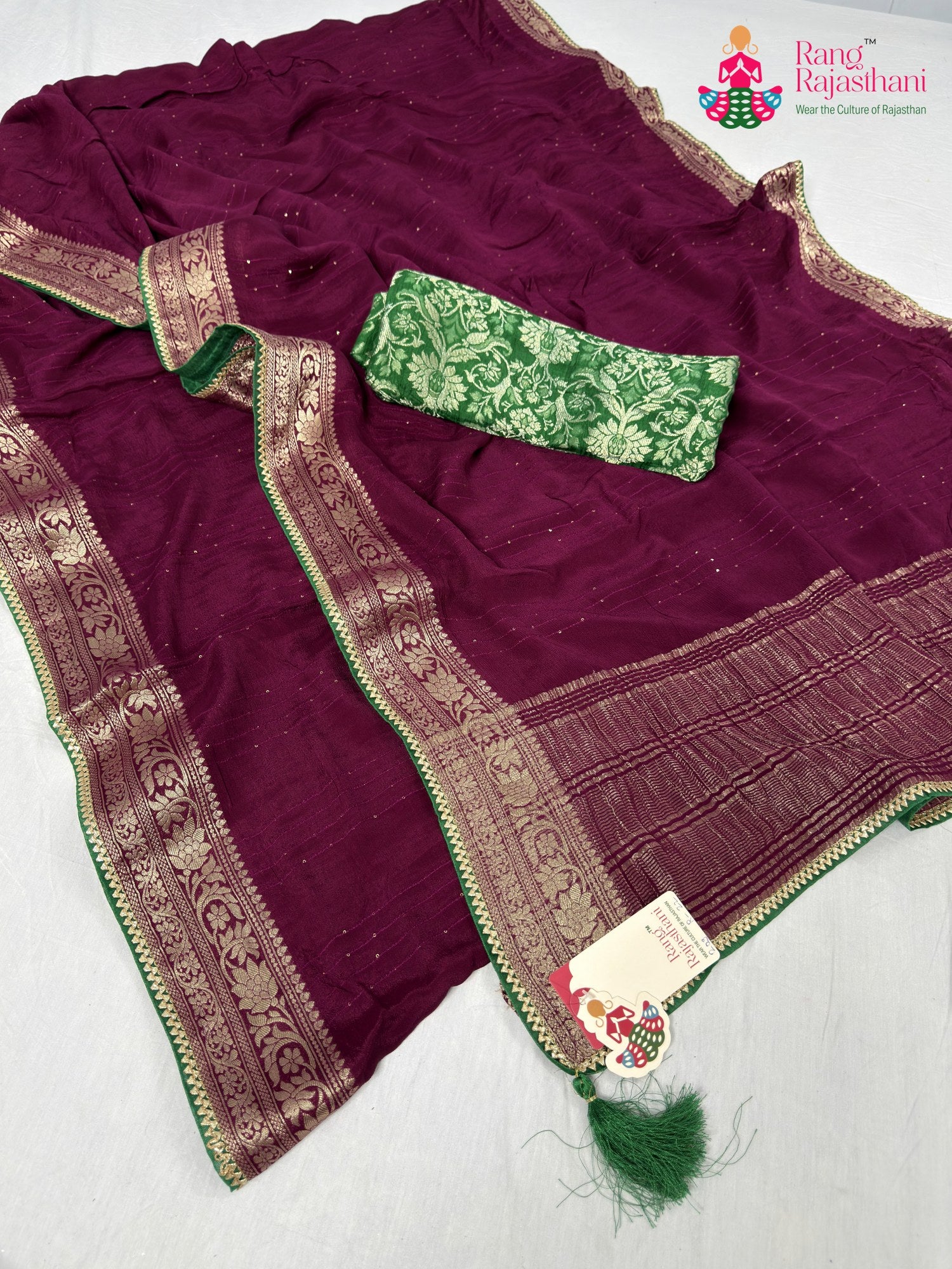 close up detailing of wine chinnon saree