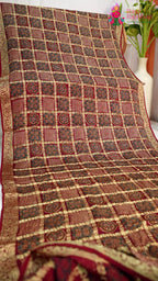 pallu detailing of wine modal banarasi zari weave gharchola saree
