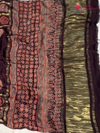 fabric texture of wine modal banarasi zari weave gharchola saree