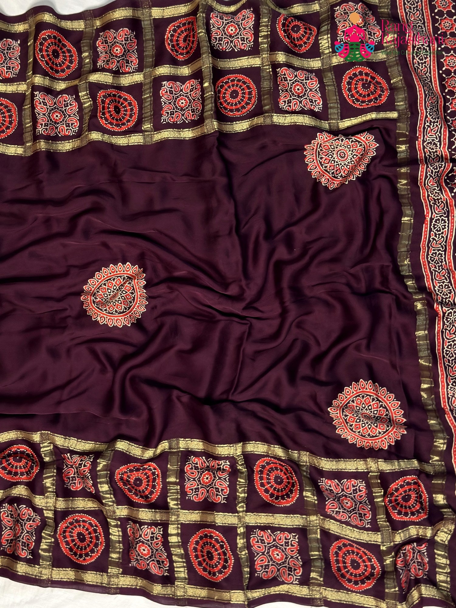 intricate detail of wine modal banarasi zari weave gharchola saree