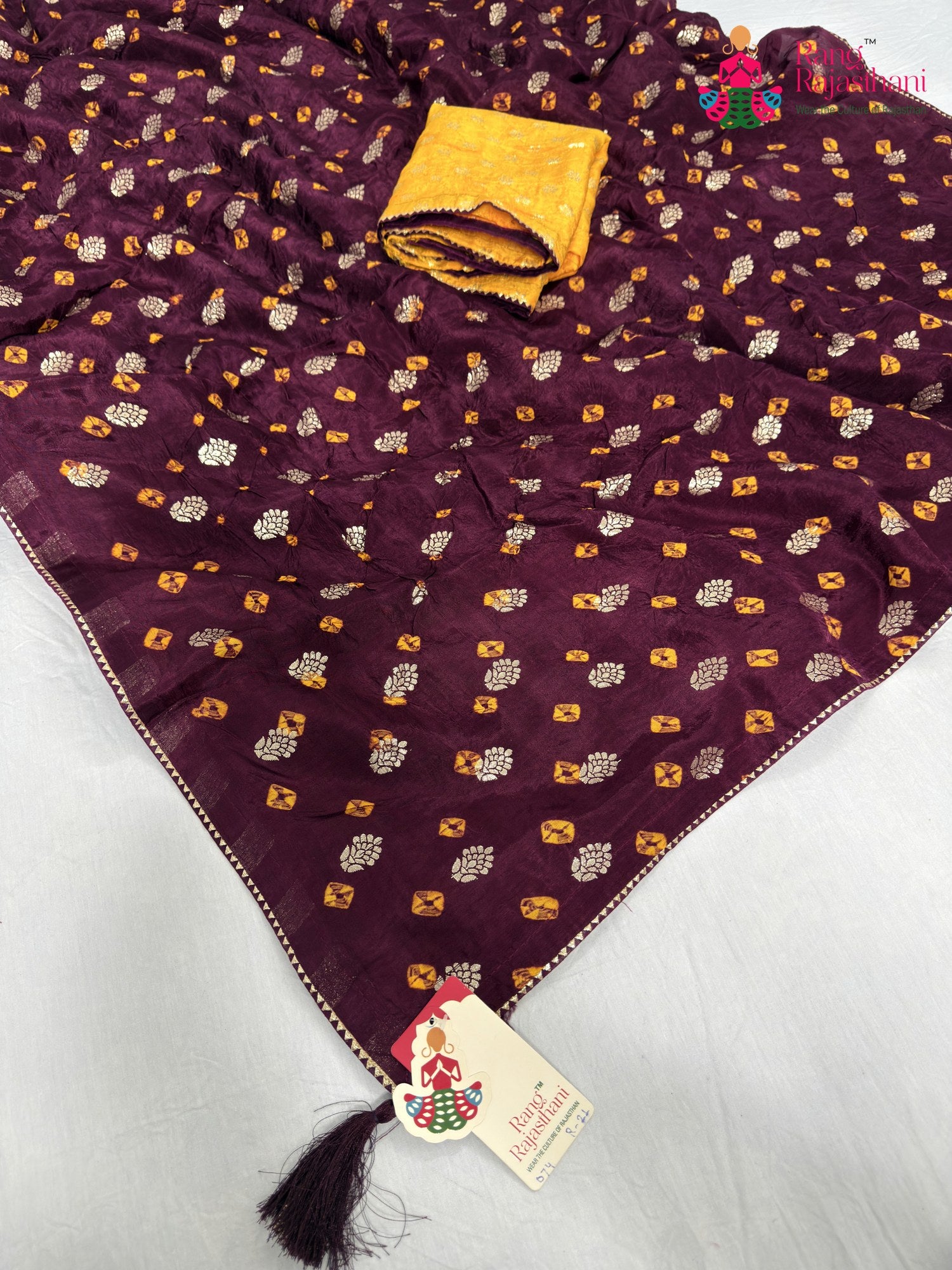 pallu detailing of wine pure dola silk bandhani saree