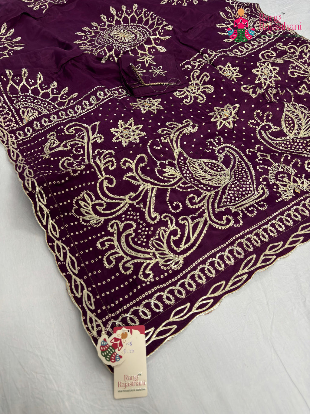 pallu detailing of wine pure upada silk bandhani saree