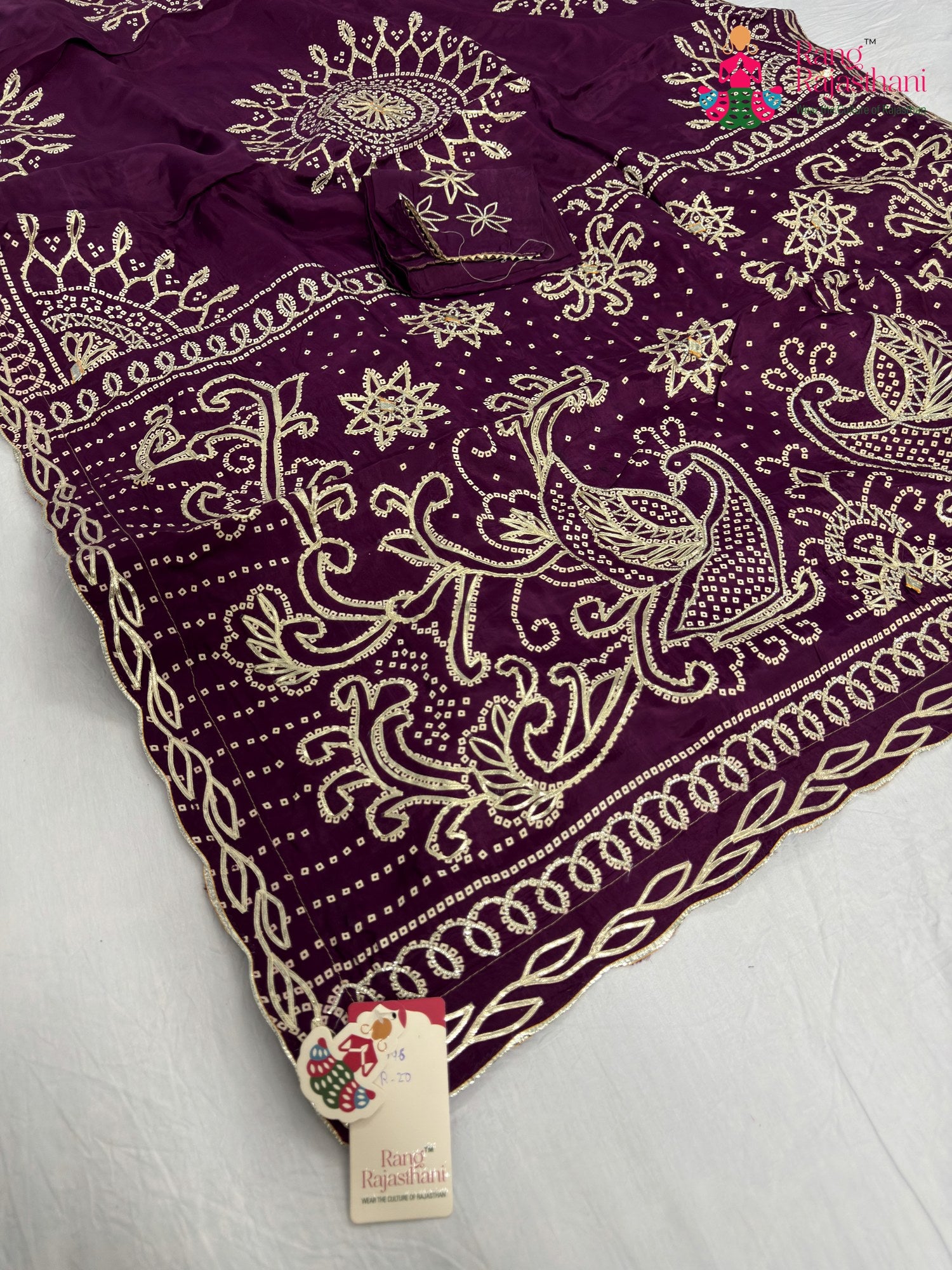 pallu detailing of wine pure upada silk bandhani saree