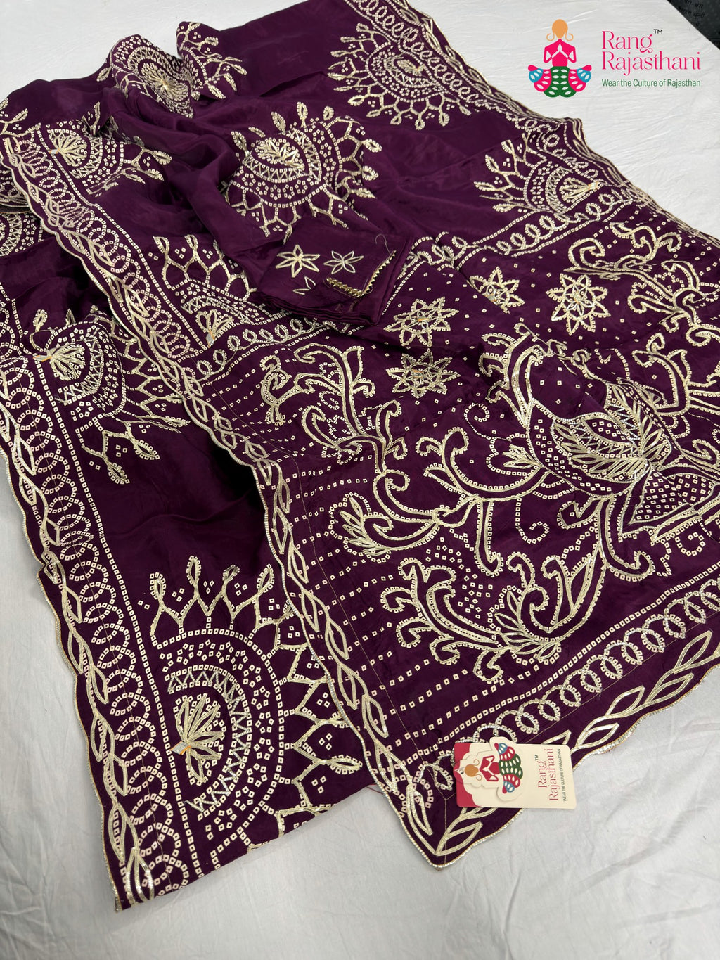 close up detailing of wine pure upada silk bandhani saree