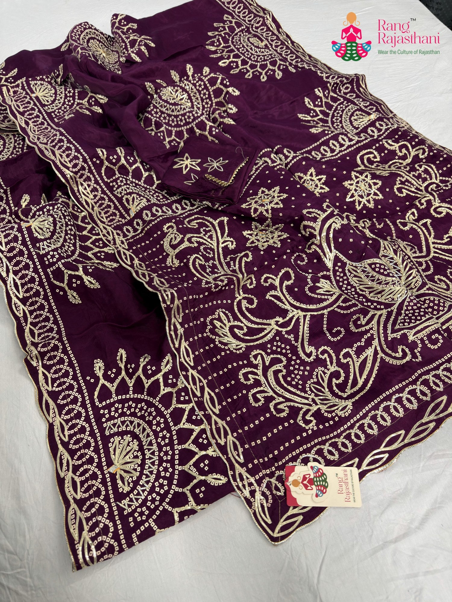close up detailing of wine pure upada silk bandhani saree