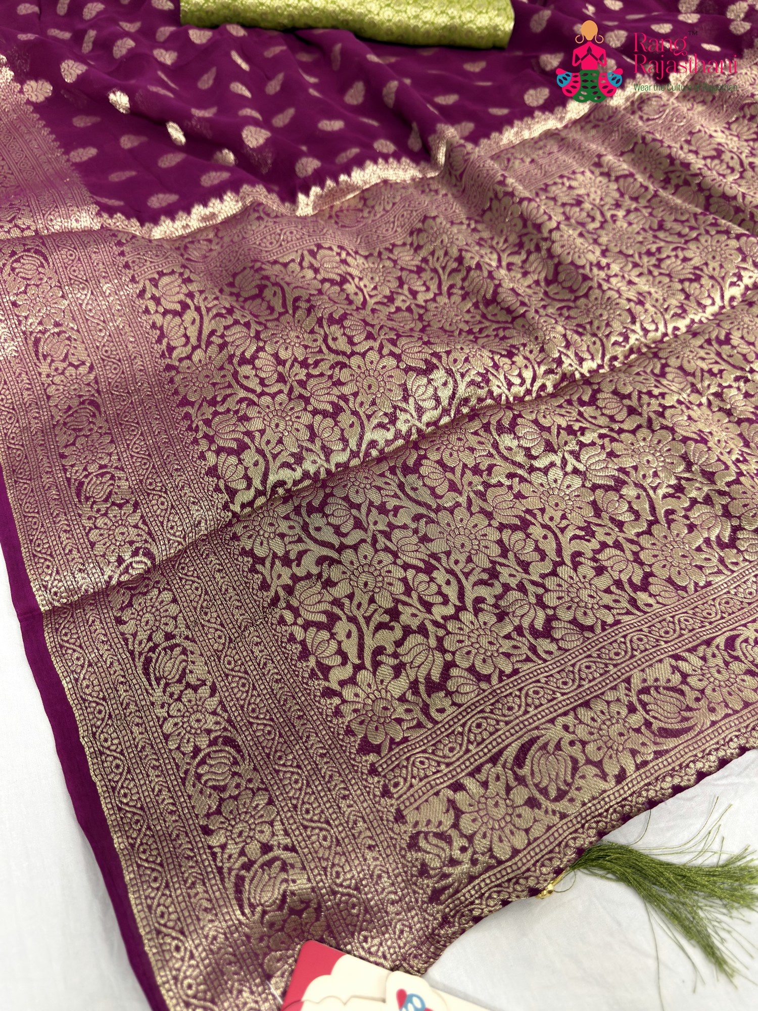 pallu detailing of wine soft georgette banarasi zari weave saree