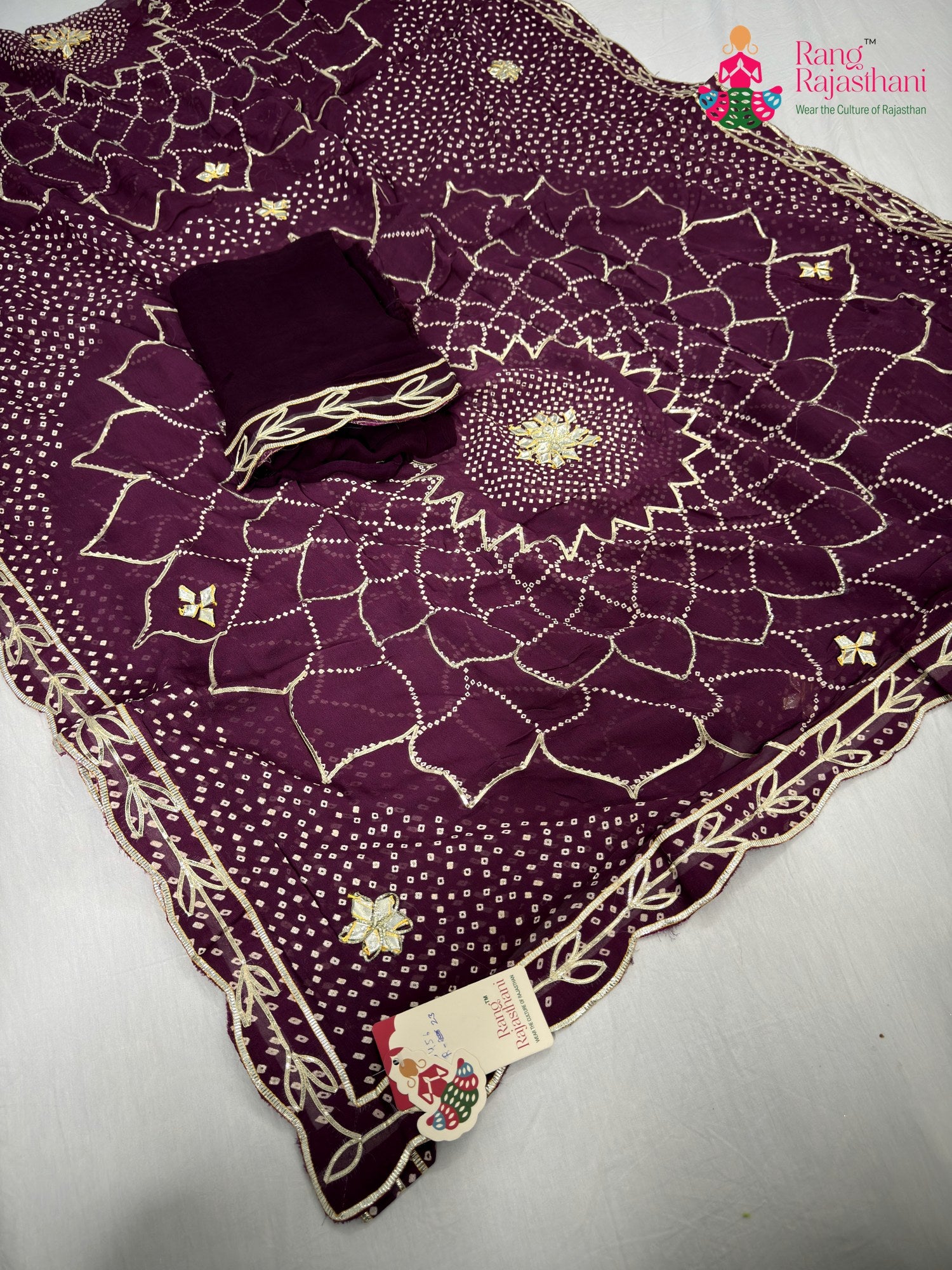 pallu detailing of wine soft georgette bandhani saree