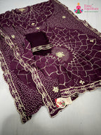 close up detailing of wine soft georgette bandhani saree