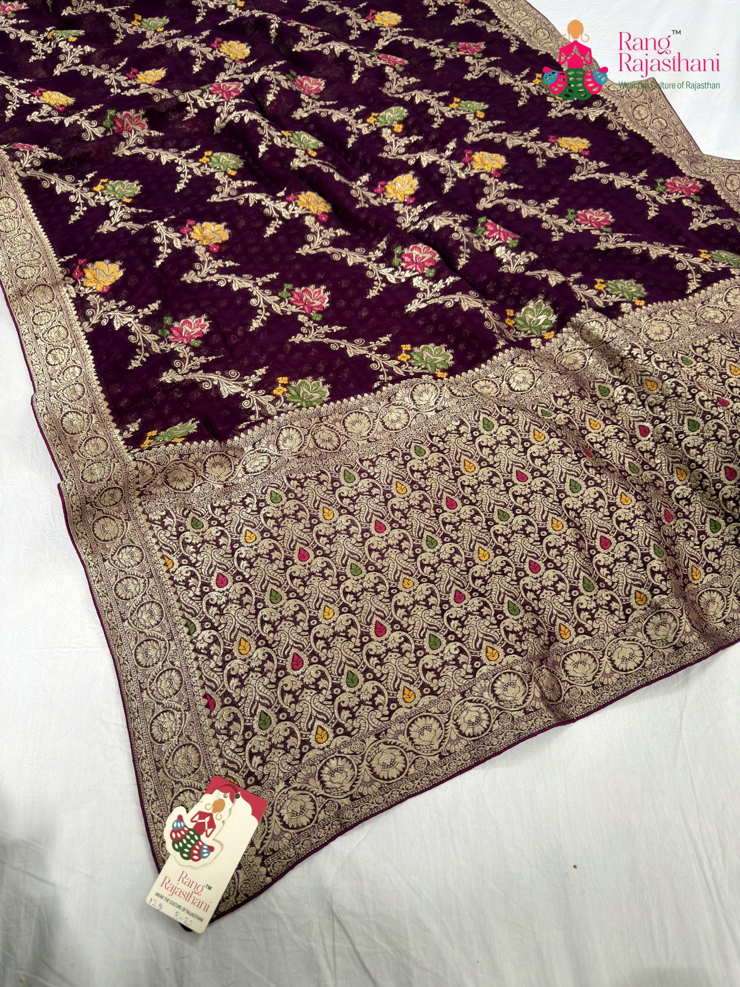 close up detailing of wine soft georgette meenakari zari saree