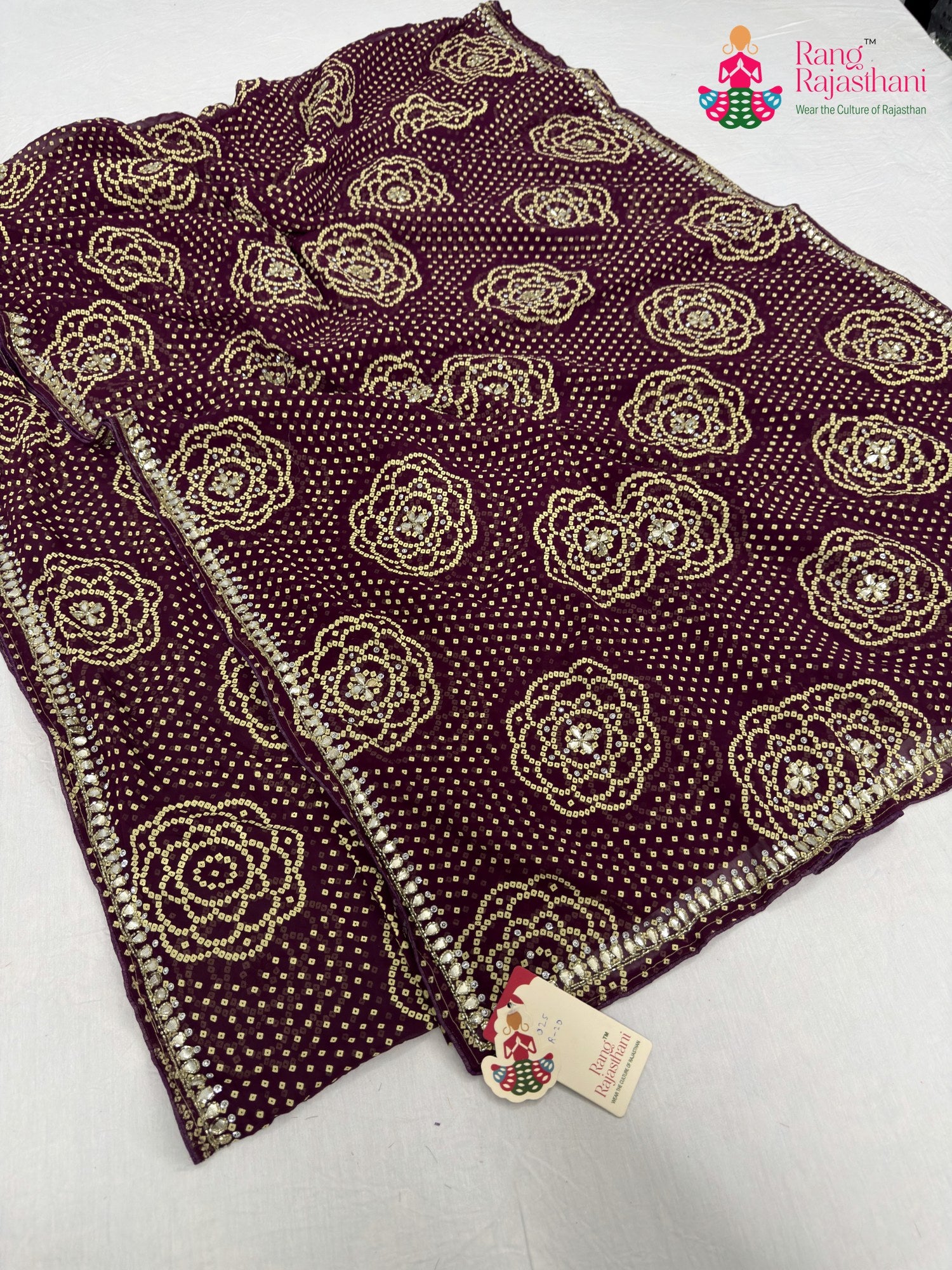 close up detailing of wine synthetic bandhani saree