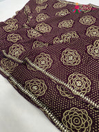 border detailing of wine synthetic bandhani saree