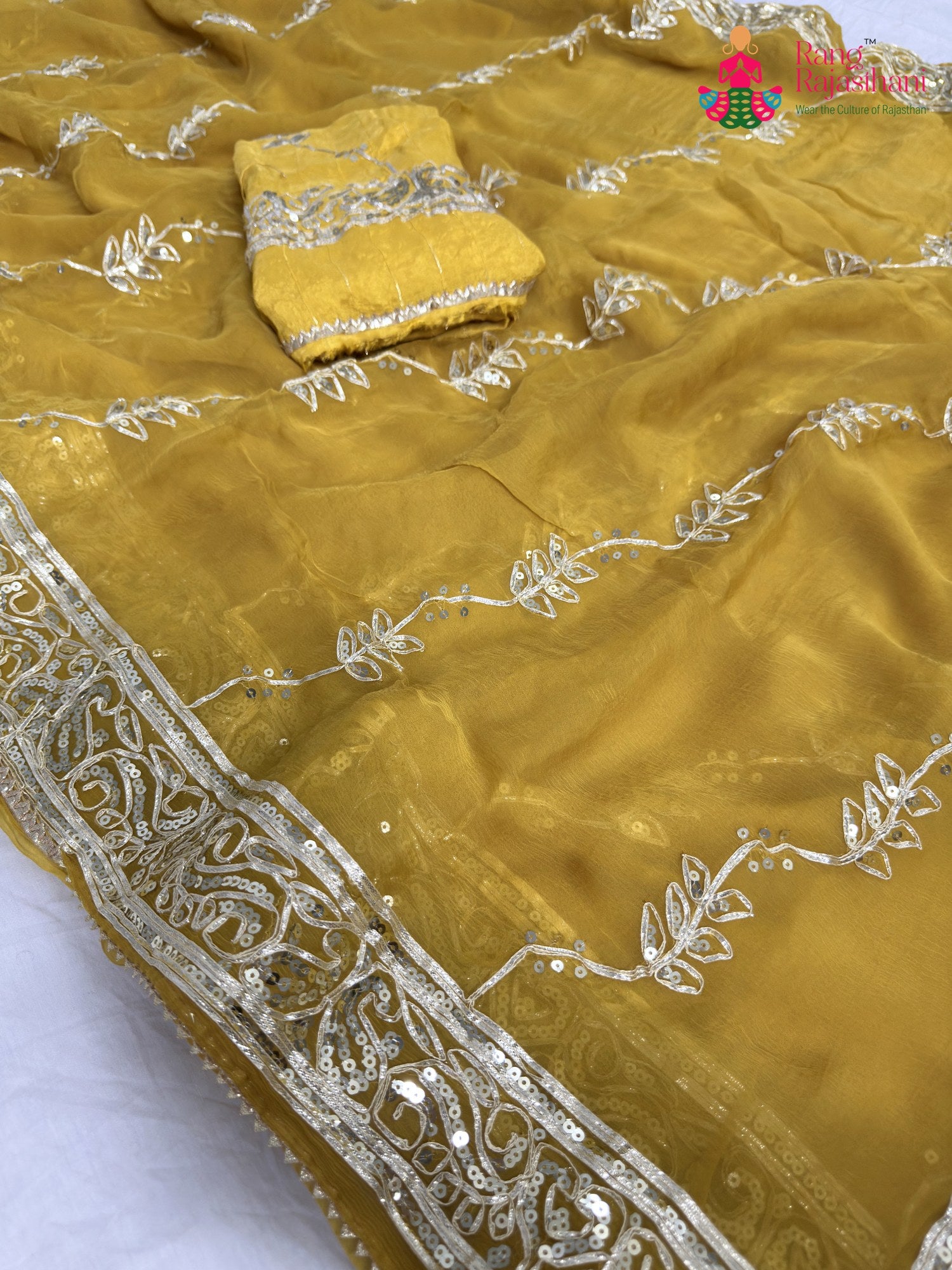 close up detailing of yellow chiffon gota patti saree