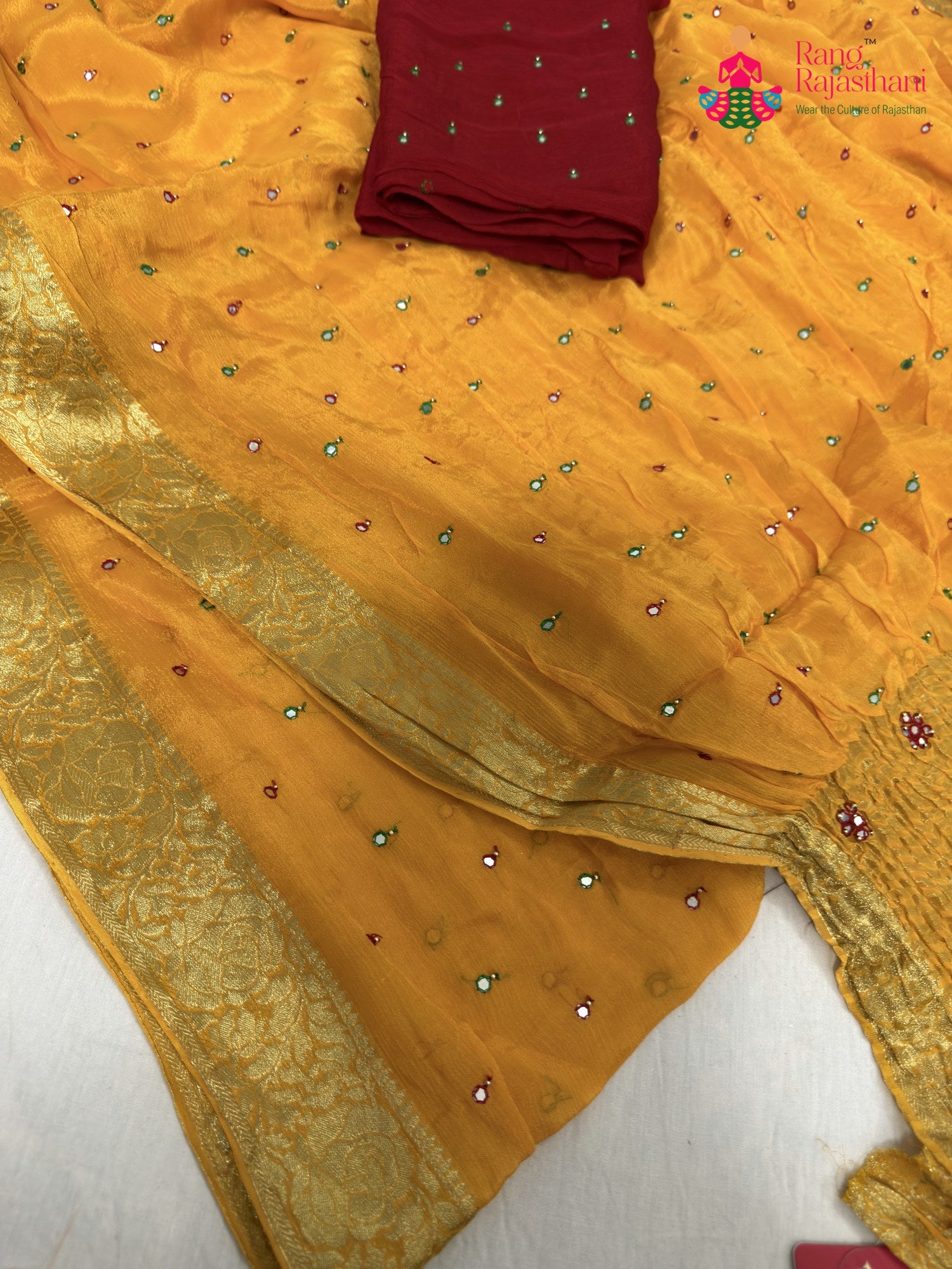 close up detailing of yellow chinnon banarasi zari weave saree