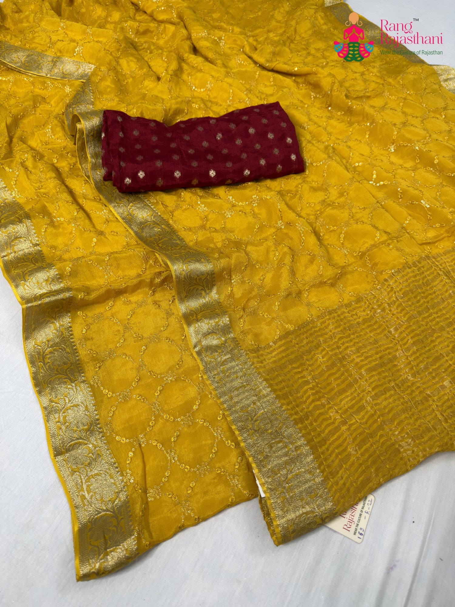 close up detailing of yellow chinnon sequin saree