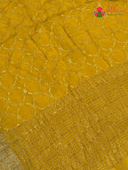 design pattern of yellow chinnon sequin saree