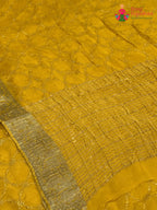 pallu detailing of yellow chinnon sequin saree