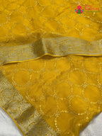 close up view of yellow chinnon sequin saree
