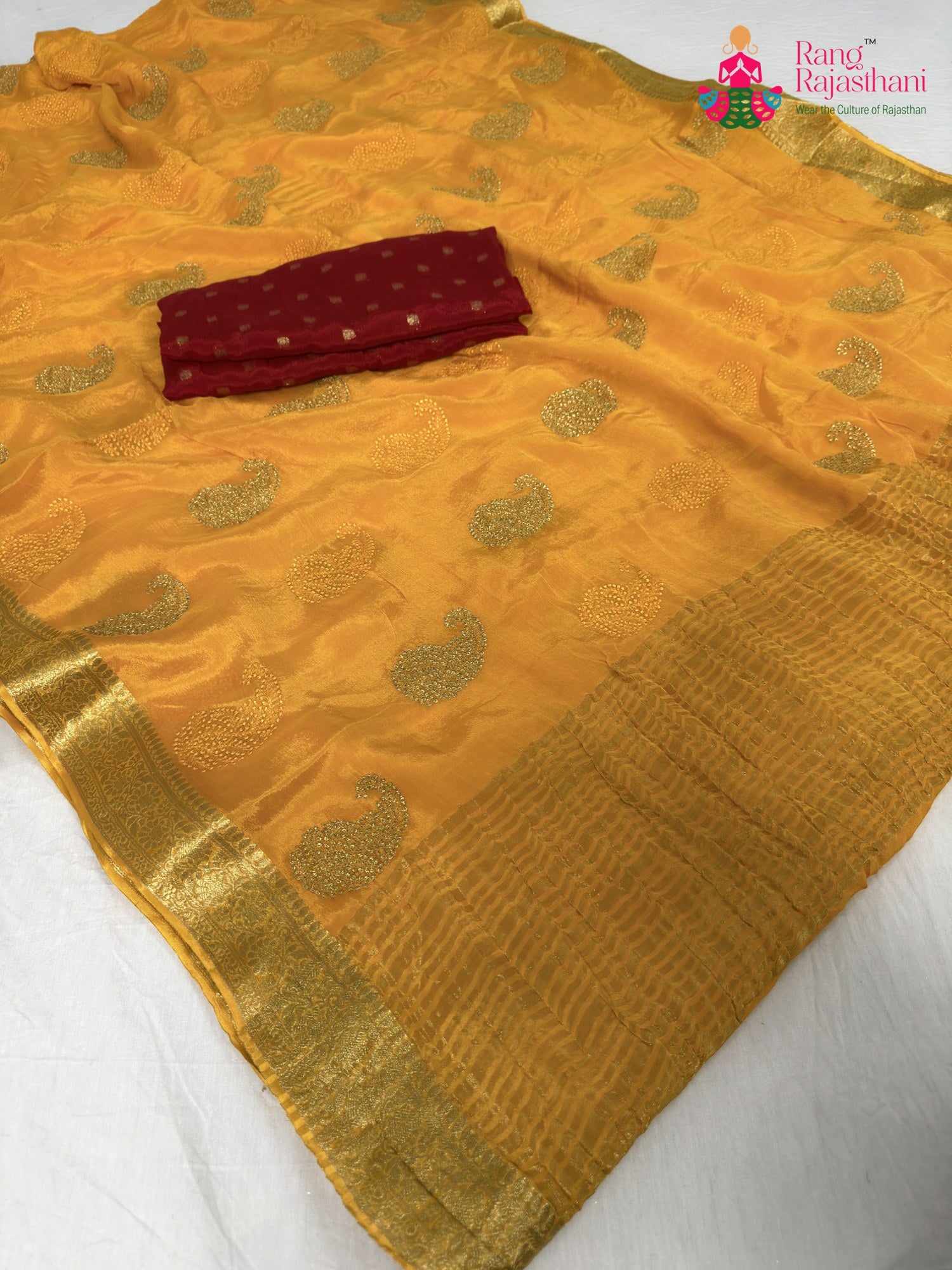 pallu detailing of yellow chinnon zari embroidery saree