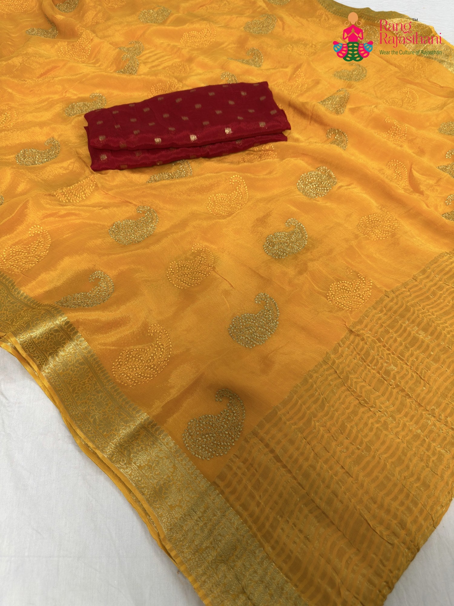 close up detailing of yellow chinnon zari embroidery saree