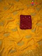 border detail of yellow chinnon zari embroidery saree