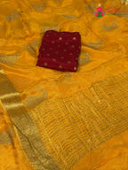 pallu detailing of yellow chinnon zari embroidery saree