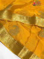 close up view of yellow chinnon zari embroidery saree