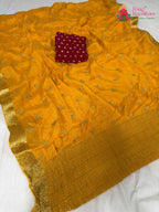 border detailing of yellow fabric saree