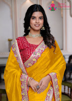 border detailing of yellow fabric saree 