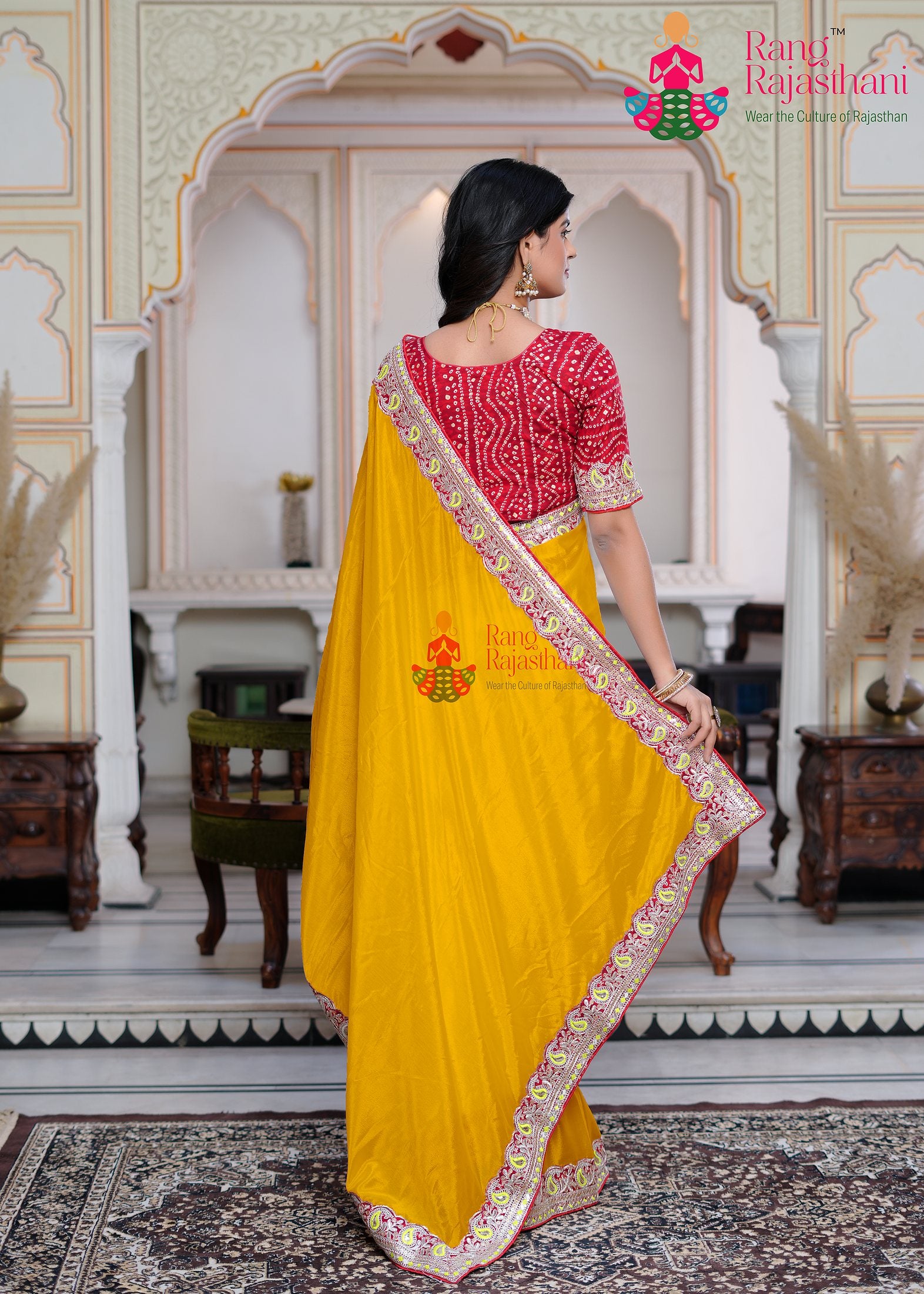 close up detailing of yellow fabric saree 