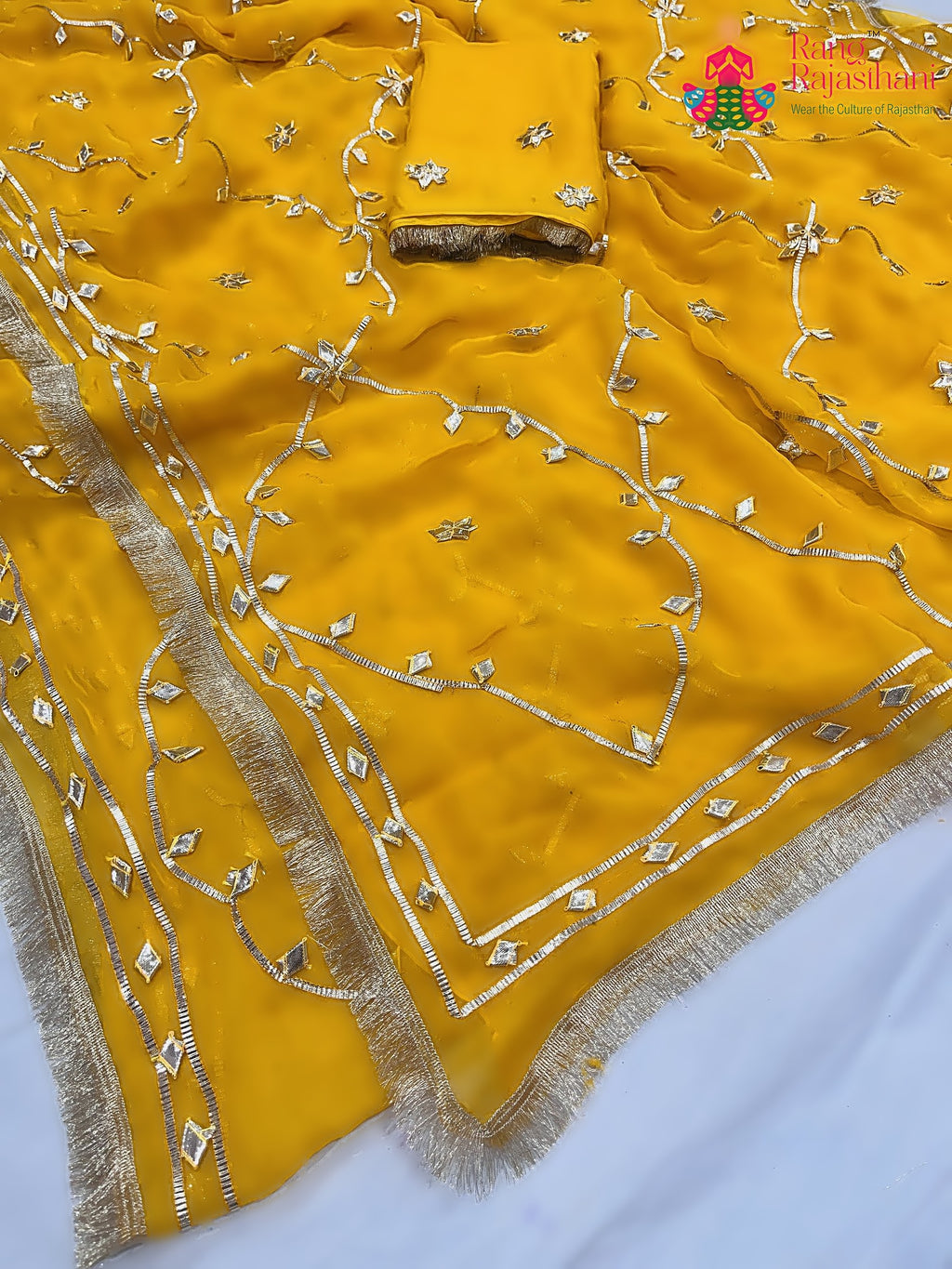 close up detailing of yellow pure chiffon gota patti saree 
