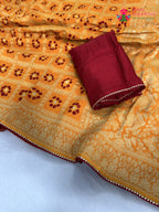 close up detailing of yellow pure dola silk bandhani saree