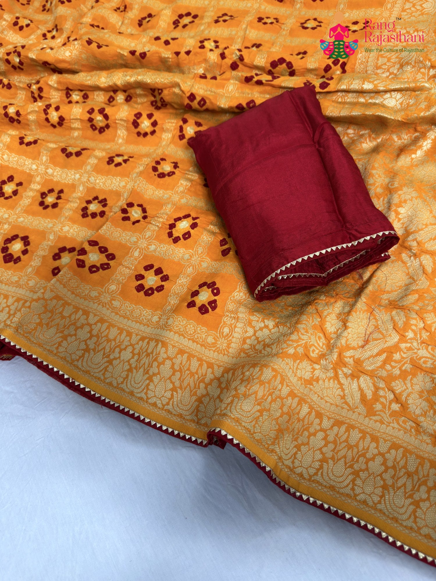 close up detailing of yellow pure dola silk bandhani saree