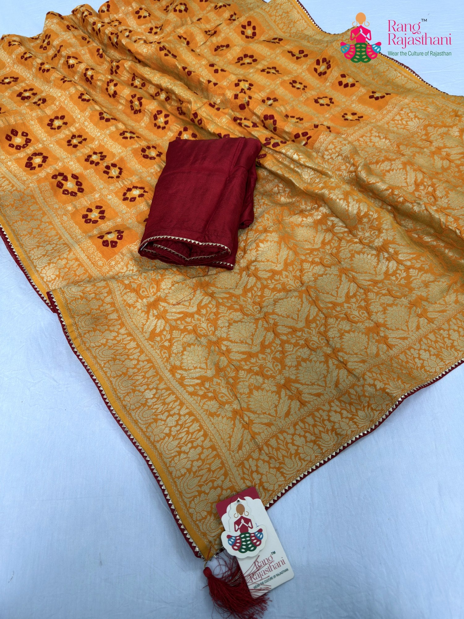border detailing of yellow pure dola silk bandhani saree