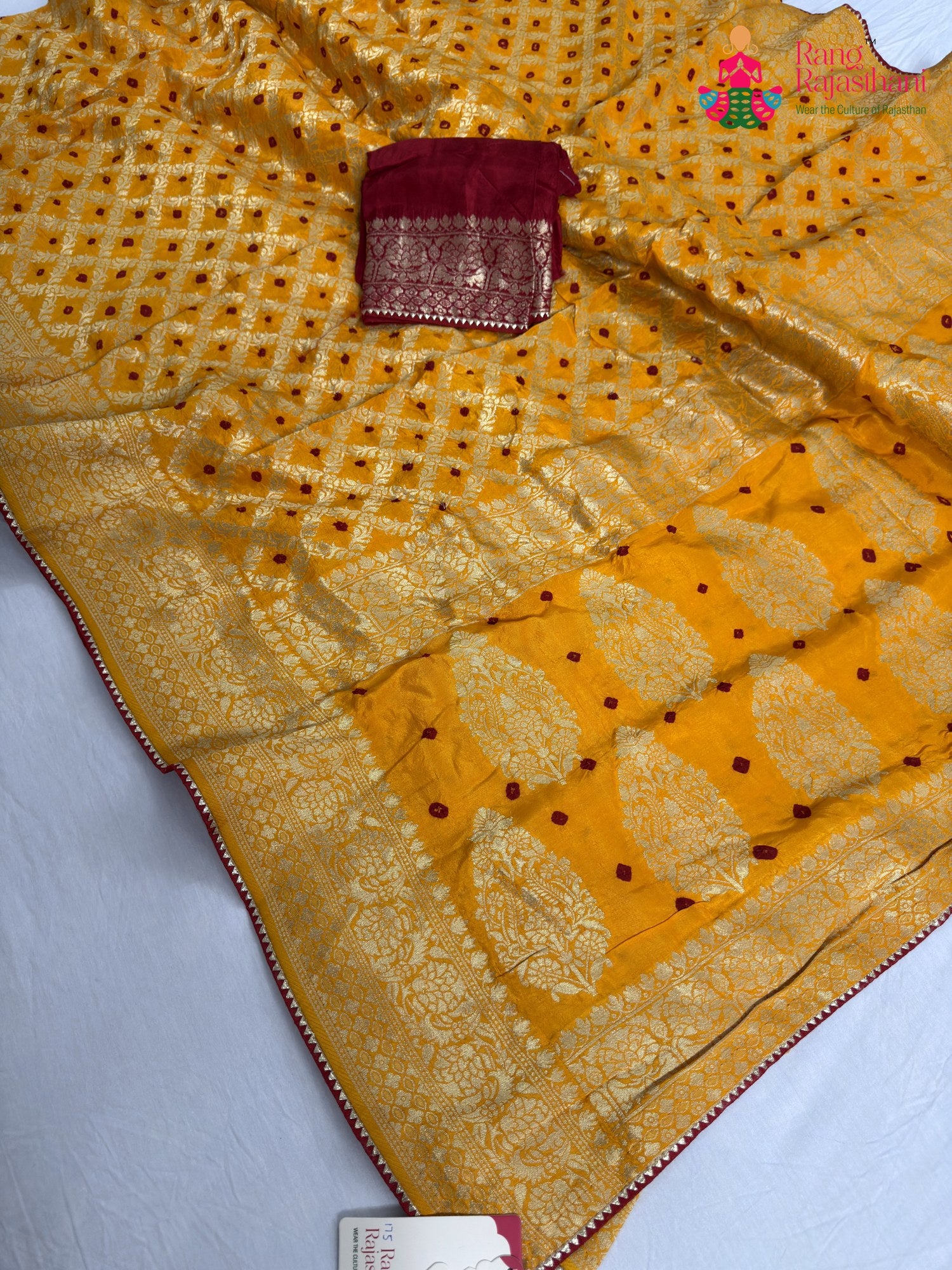 pallu detailing of yellow pure dola silk bandhani saree