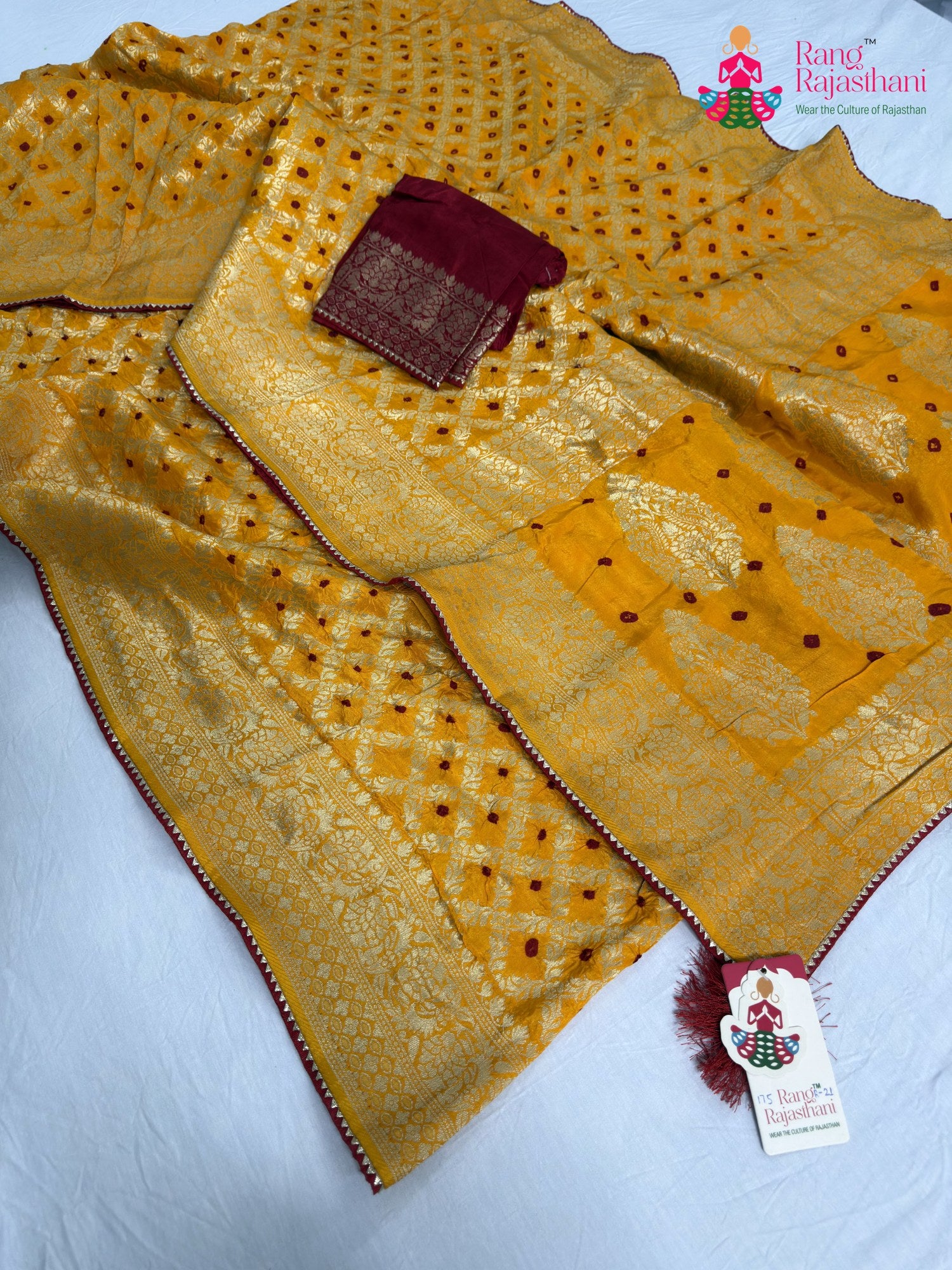 close up detailing of yellow pure dola silk bandhani saree