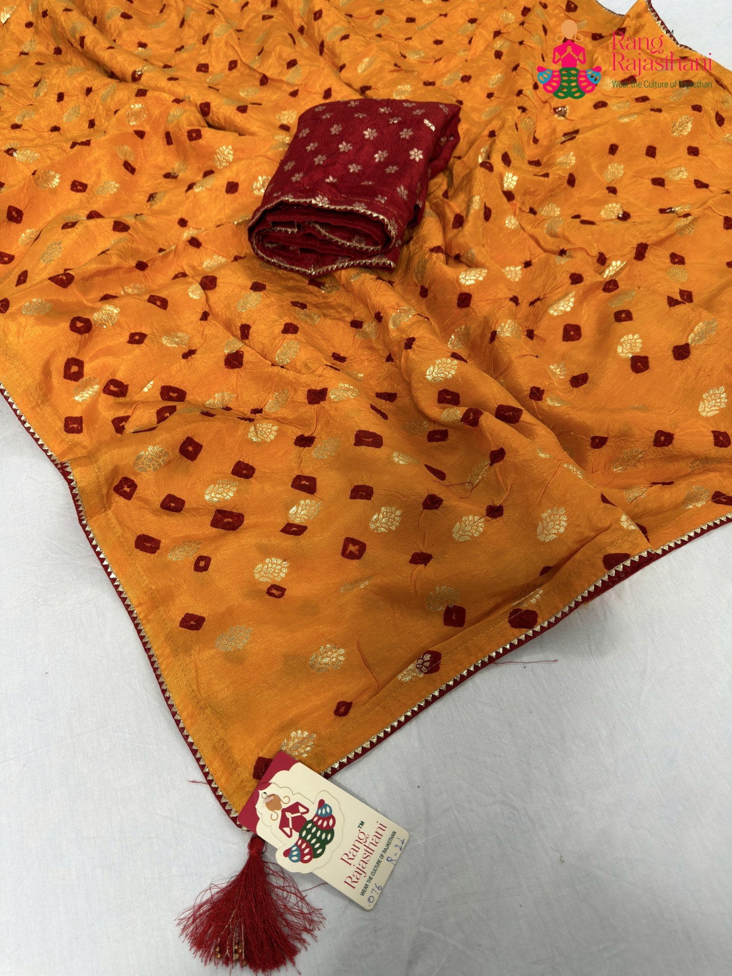 close up detailing of yellow pure dola silk bandhani saree
