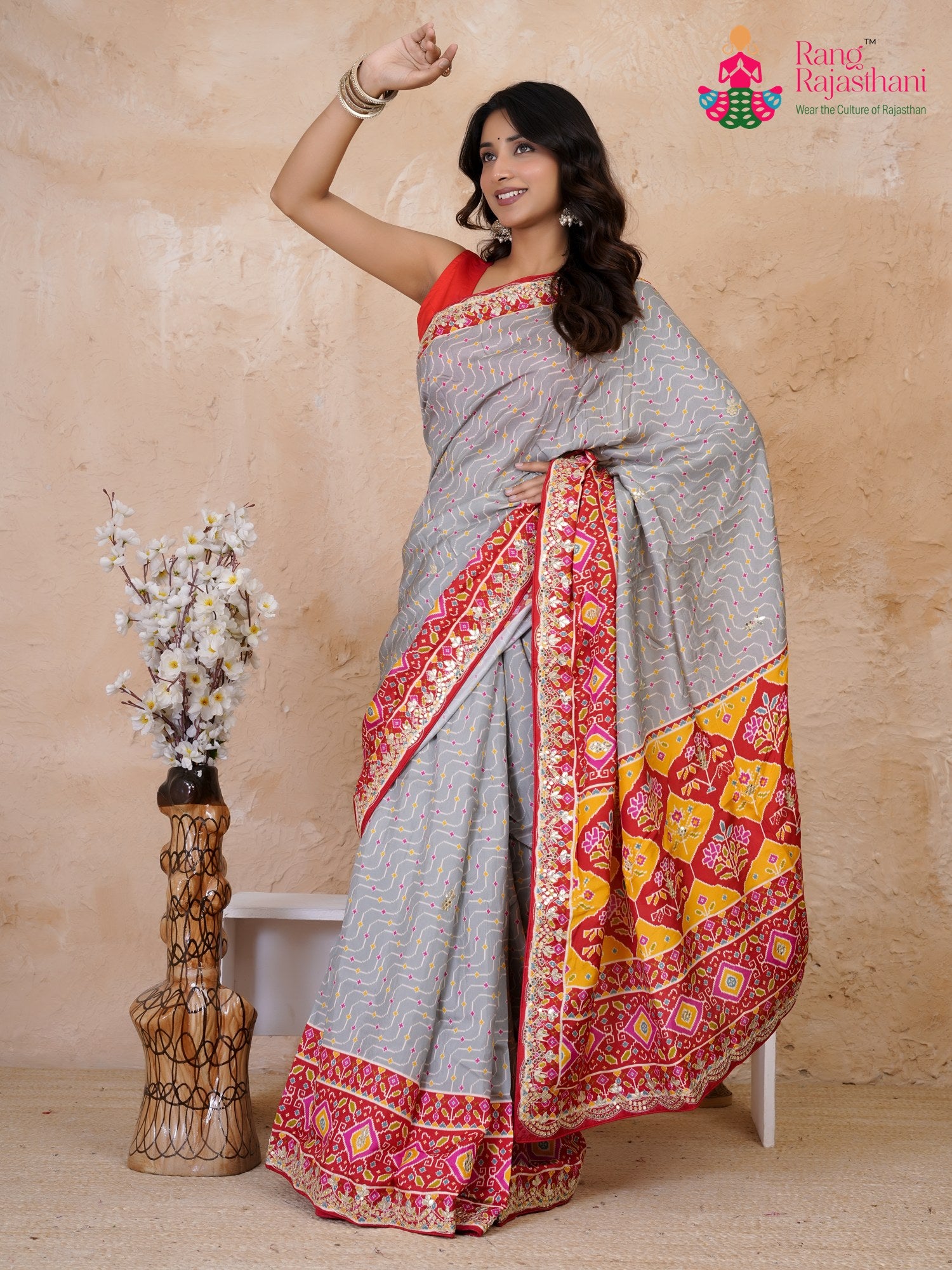 intricate detail of yellow pure russian silk gota patti saree
