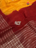 close up view of yellow russian silk hand embellishment pila saree