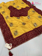 border detailing of yellow red silk saree