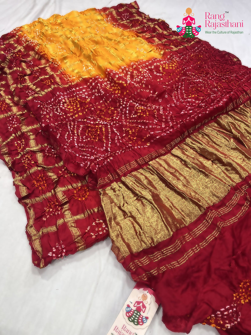 close up detailing of yellow russian silk bandhani gharchola saree 