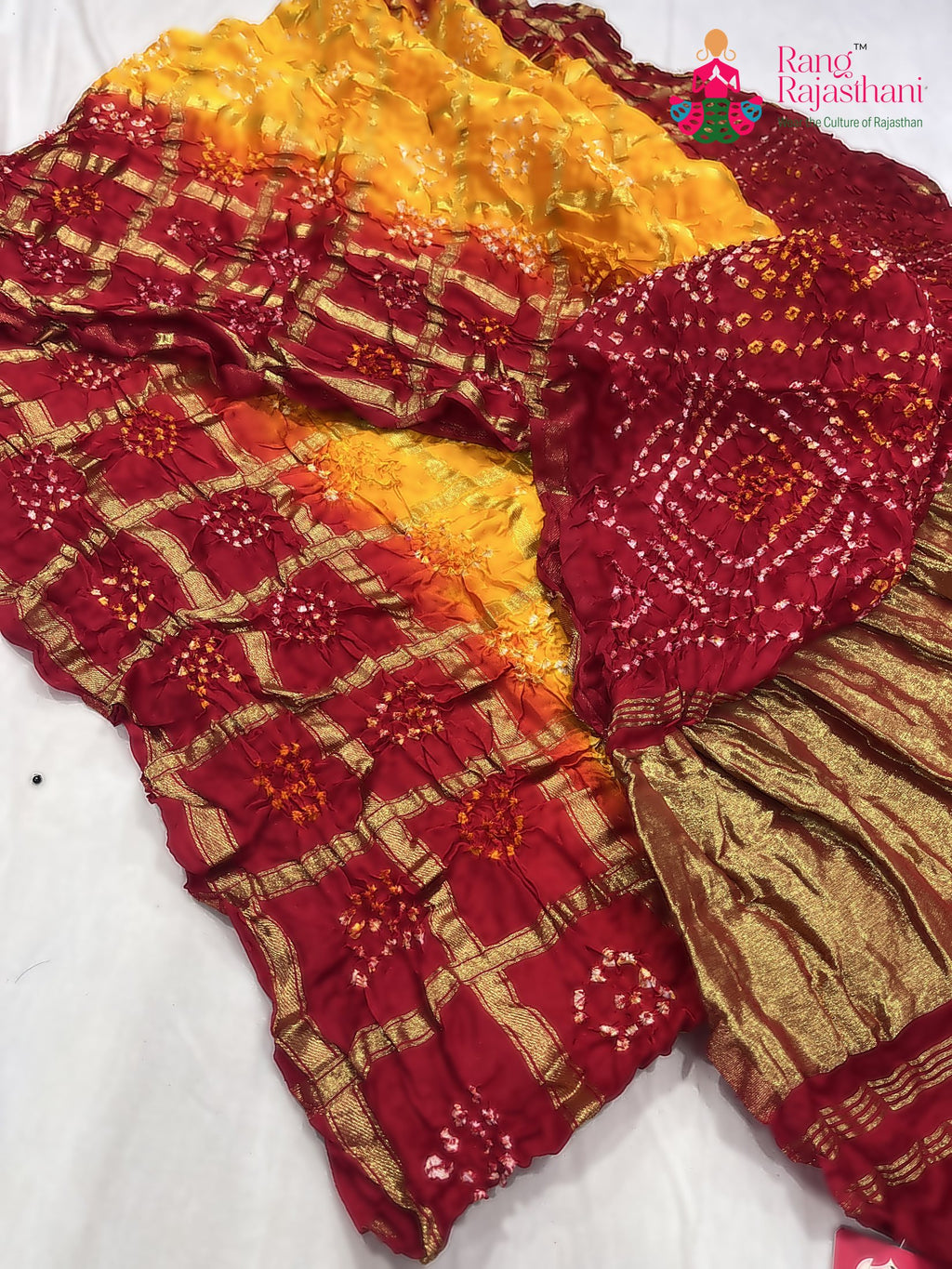 pallu detailing of yellow russian silk bandhani gharchola saree 