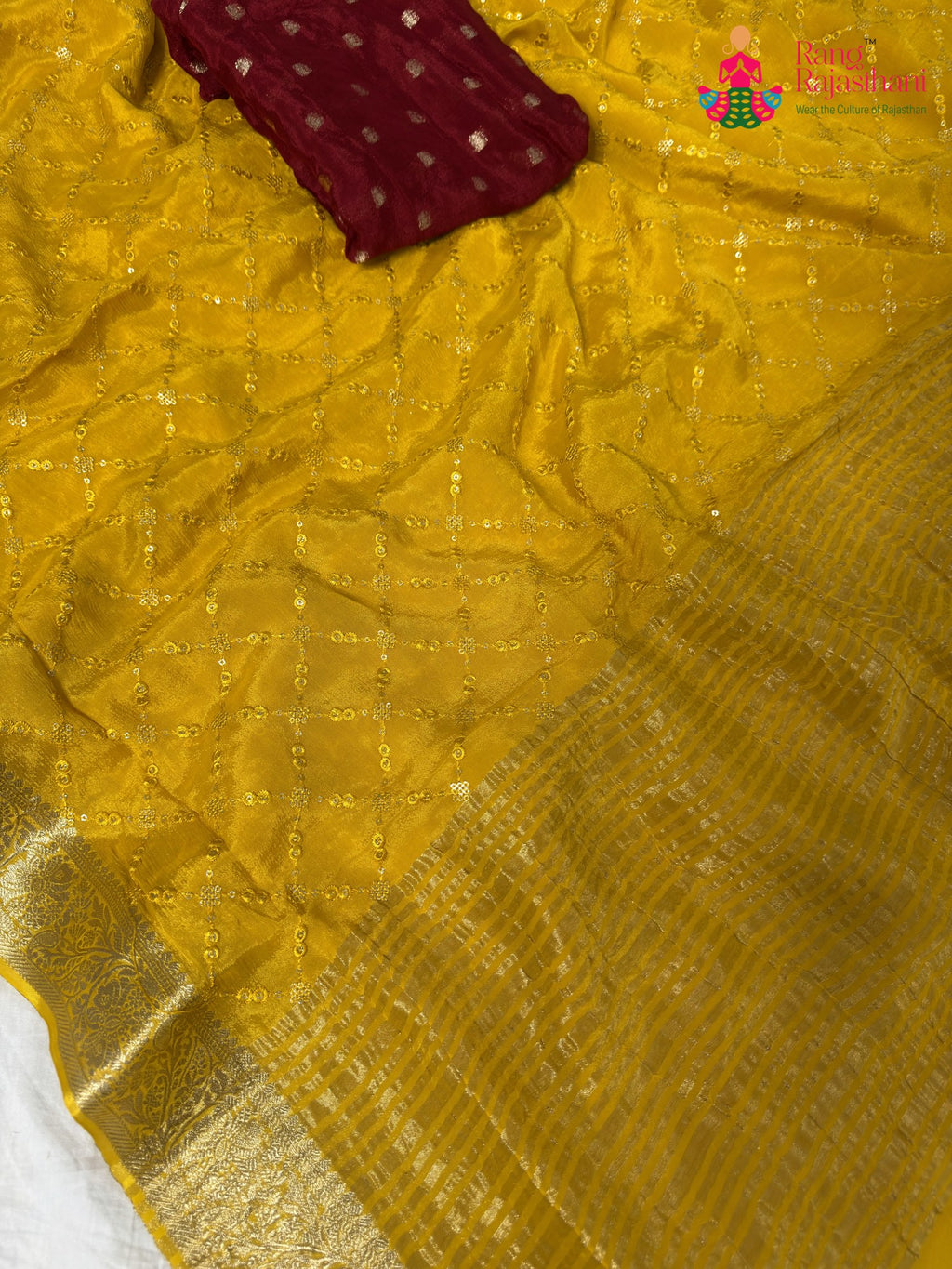 border detailing of yellow saree