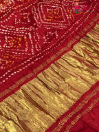 border detail of yellow russian silk bandhani gharchola saree