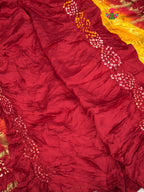 close up view of yellow russian silk bandhani gharchola saree