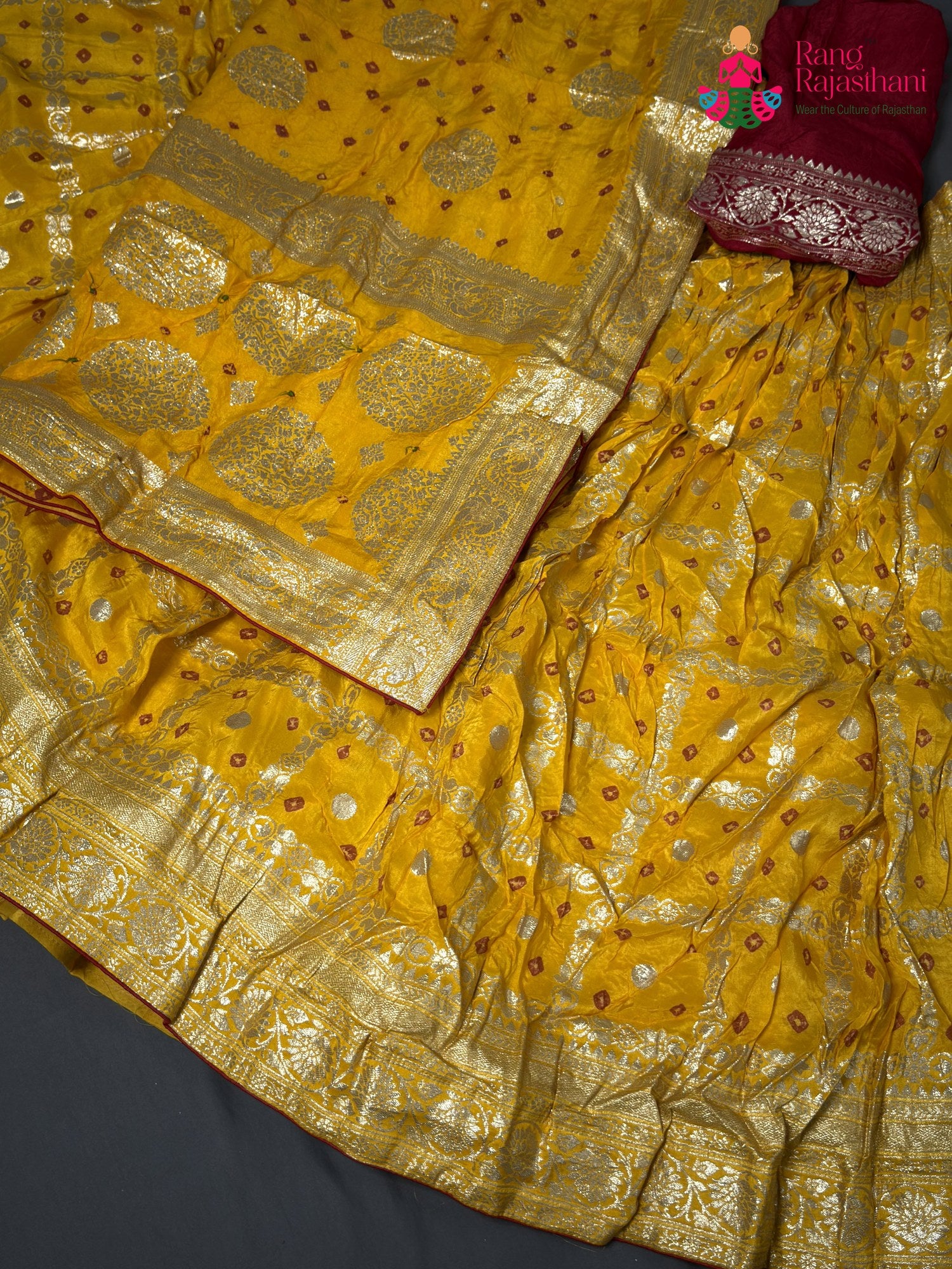 chunni detail of yellow silk bandhani saree
