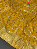 lehenga flare detailing of yellow silk bandhani saree