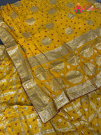 border detail of yellow silk bandhani saree